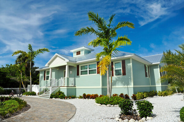 Florida style home front yoard and palm trees